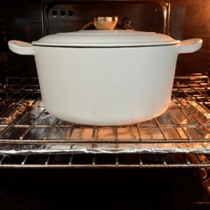 Stop burning the bottom of your sourdough by placing a baking tray underneath your dutch oven when cooking your bread.