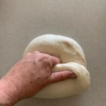 Shaping sourdough pane di casa dough.