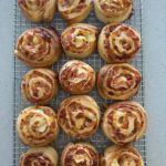 Sourdough pinwheels cooling on a wire rack