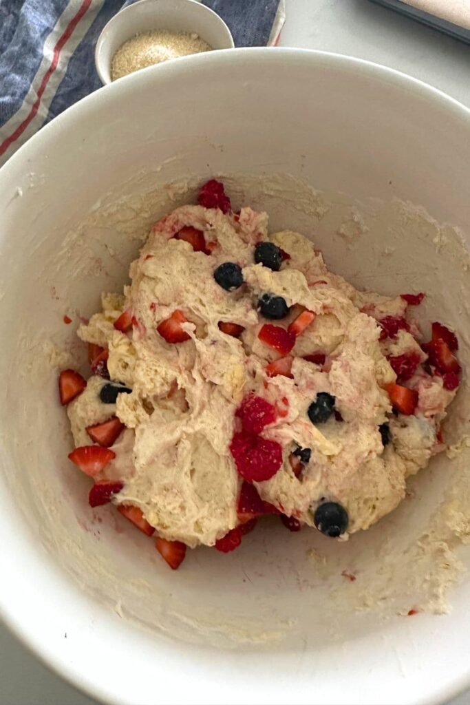 Sourdough berry sheet pan dough studded with blueberries and strawberries.