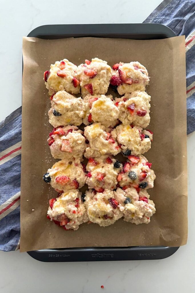 15 balls of sourdough berry shortcake dough layed out in a 3 x 15 formation.